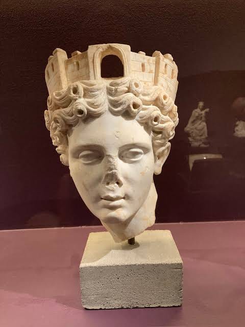 Marble head of Tyche wearing a mural crown